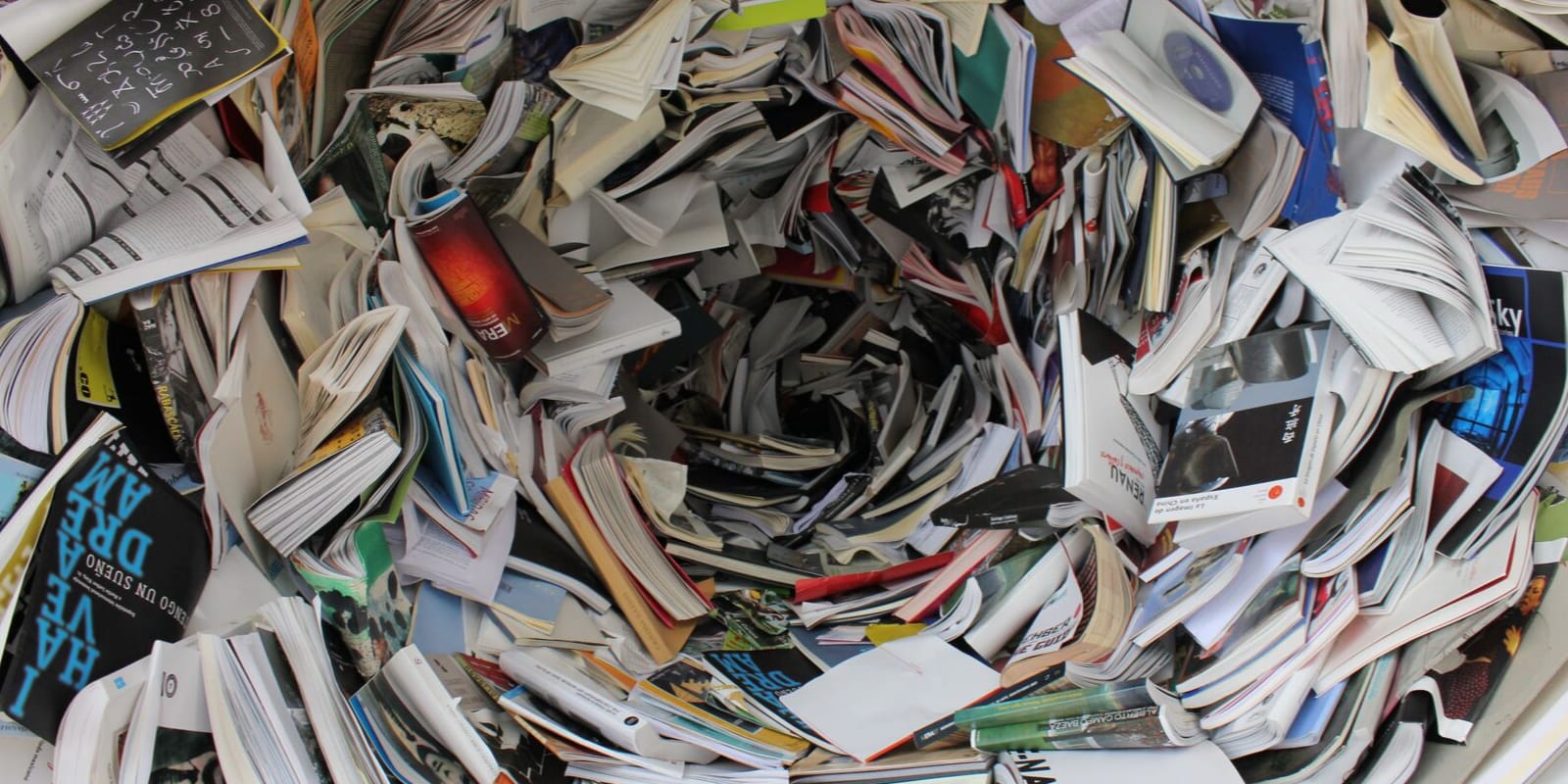 A lot of books representing one of the 15 biggest language-learning mistakes "Attack Several Languages at Once"